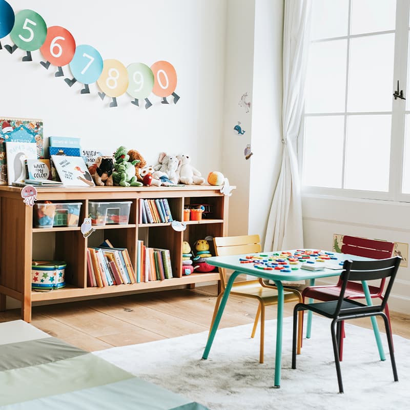 Children's classroom with wall decor and bookshelf.