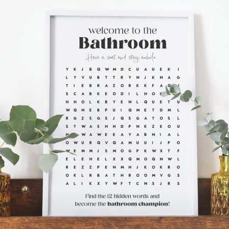 Bathroom word search printable preview in frame on shelf.