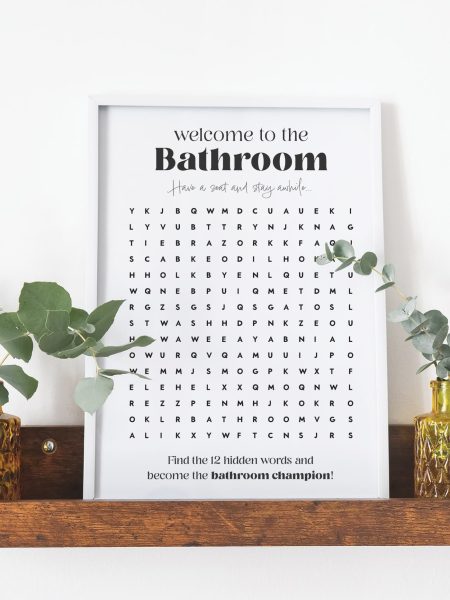 Bathroom word search printable preview in frame on shelf.