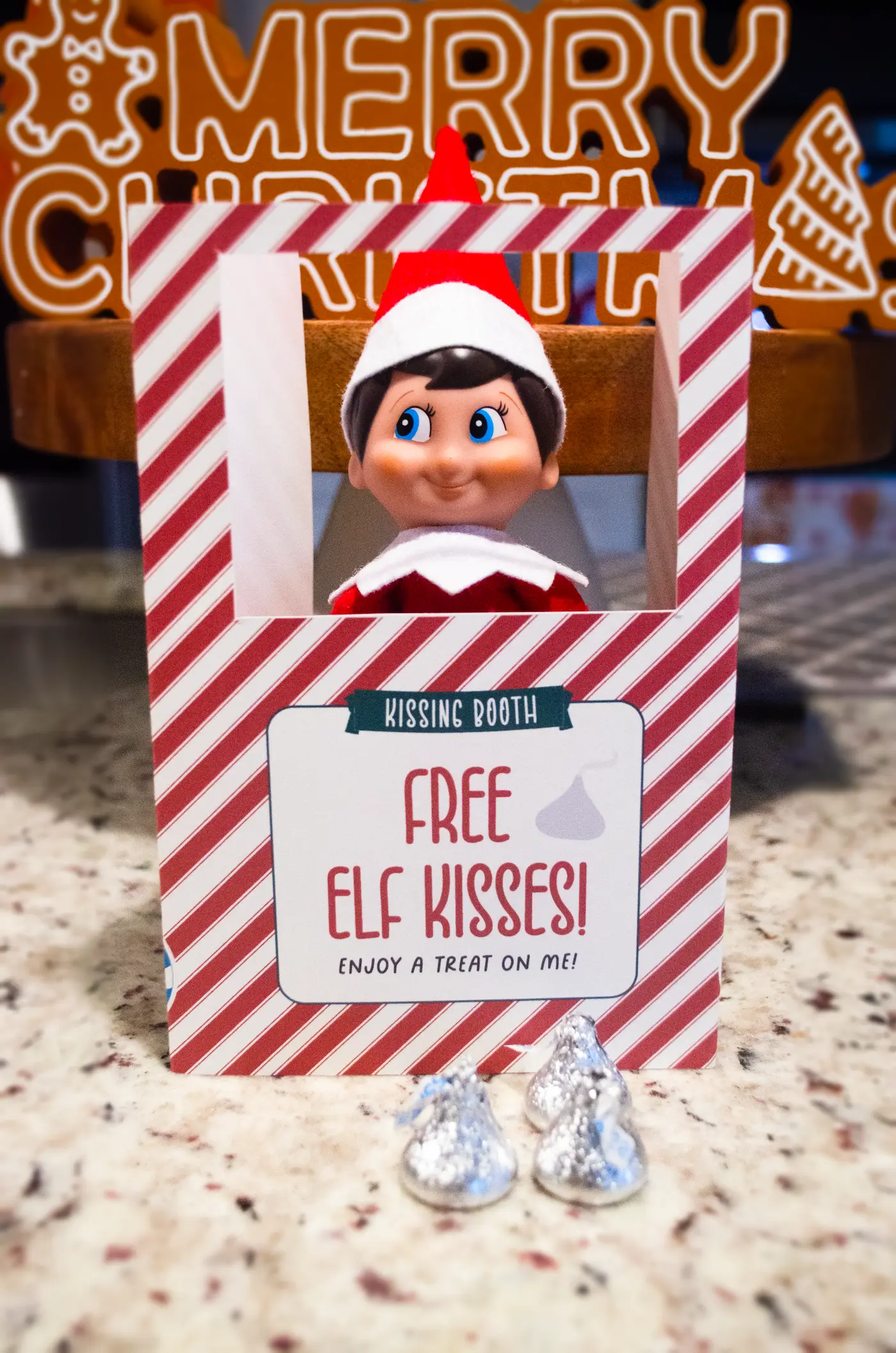 Free printable Elf on the Shelf kissing booth.