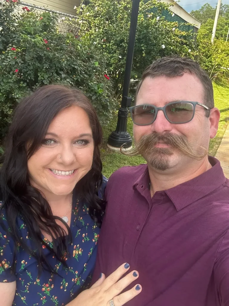 Laura, author of Favorite Printables, posing and smiling with husband.